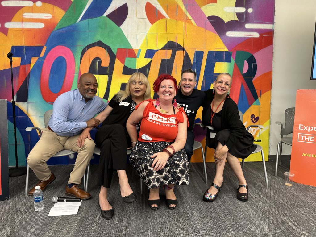 A group of panelists and the conference MC, Emma Louise Roberts.  The panelists are from left to right, Rod McCoy, Angel Santanna, Damon Jacobs, and Krishna Stone.